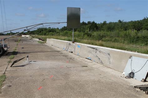 Sign on Concrete Median Barrier - Roadside Safety Pooled Fund