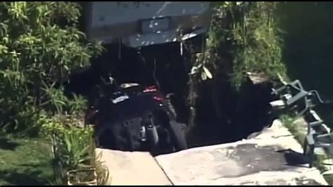 Crazy Sinkhole Swallows Car Forces Evacuations Of Homes In Florida