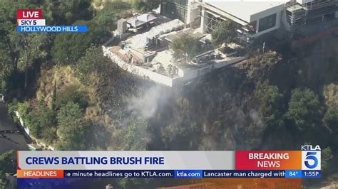 Firefighters Battling Blaze Beneath Hollywood Hills Homes Youtube