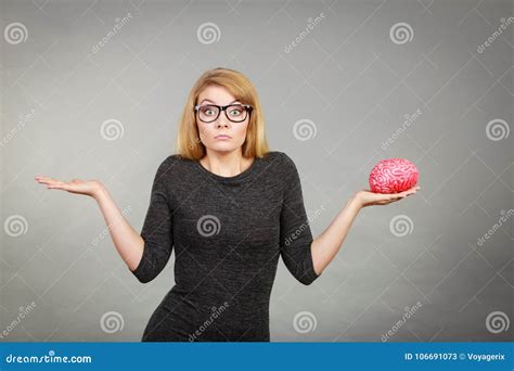 Woman In Eyeglasses Being Confused Holding Brain Stock Image Image Of Uncertain Intellect