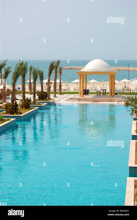 Swimming pool and beach of luxury hotel, Dubai, UAE Stock Photo - Alamy