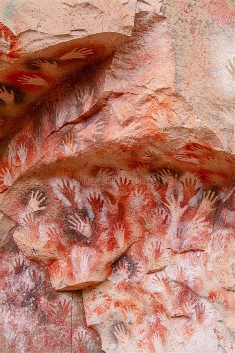 Vertical Image Of Handprints On Rock Walls At Cueva De Las Manos