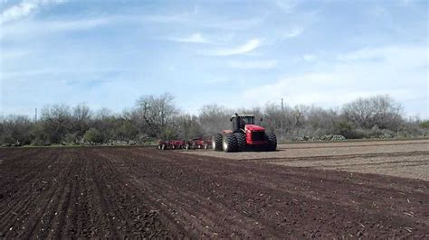 Versatile 550 Tractor Pulling A 56 Farm King Chisel Plow Near