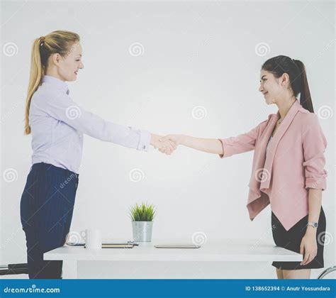 Business Handshake Between Business Woman Over A Success Deal Stock