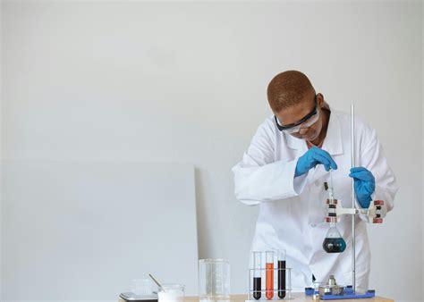 teenage student conducting research  chemical laboratory  stock