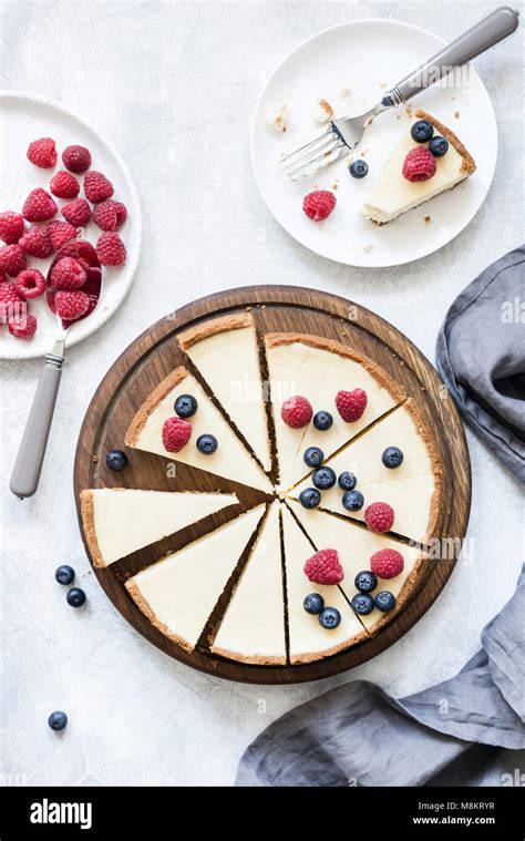 Classic New York Cheesecake With Fresh Raspberries And Blueberries On