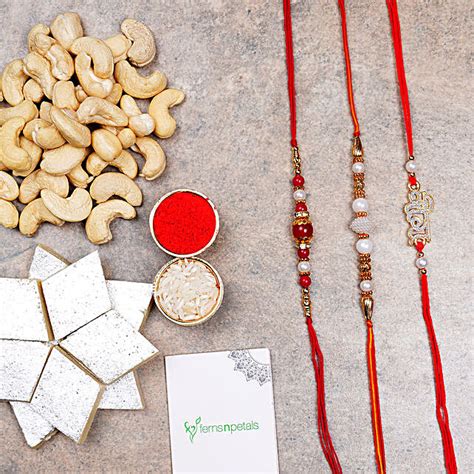 Three Rakhis With Kaju Katli And Cashews Uae Gift Three Rakhis With