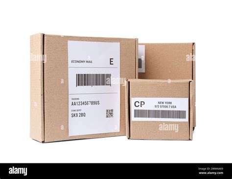 Cardboard packages with shipping labels and barcodes on white ...