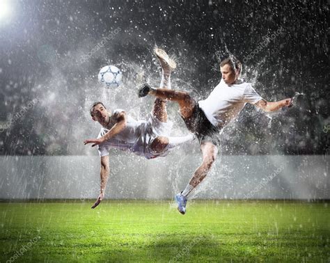 Two football players striking the ball — Stock Photo © SergeyNivens #21113229