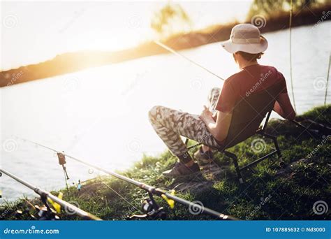 Young Man Fishing At Pond And Enjoying Hobby Stock Photo Image Of