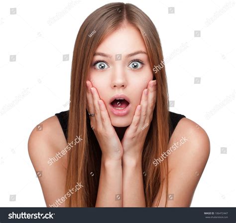 Close Up Portrait Of Surprised Beautiful Girl Holding Her Head In