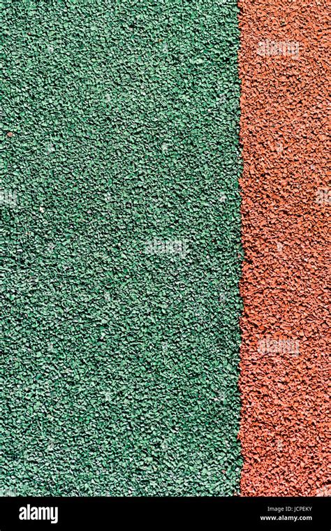 Rubber Colored Safety Coating Of Sports Playground Closeup Background