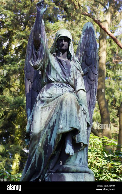 Angel statue on cemetery Stock Photo - Alamy