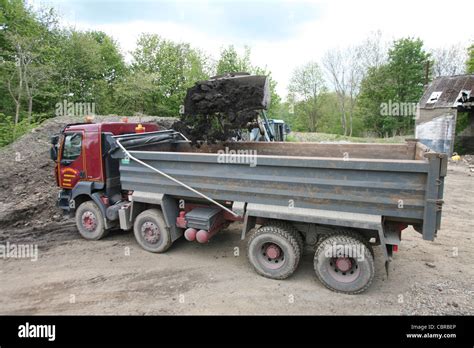 Digger Loading A Tipper Truck With Soil Stock Photo Alamy