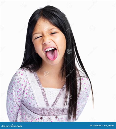 Stock Photo: Funny mixed race girl sticking out tongue on white. Image: 14976960