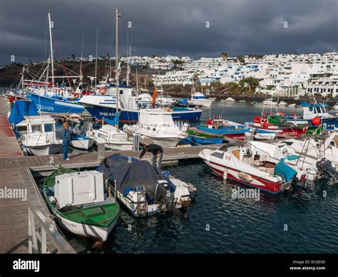 Fishing Boats And Pleasure Craft In The Harbour At Puerto Del Carmen