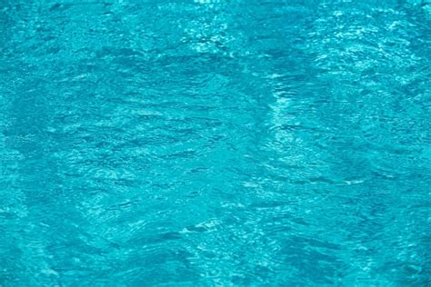 Fondo De Agua Azul En La Piscina Con Reflejo Del Sol Onda De Agua