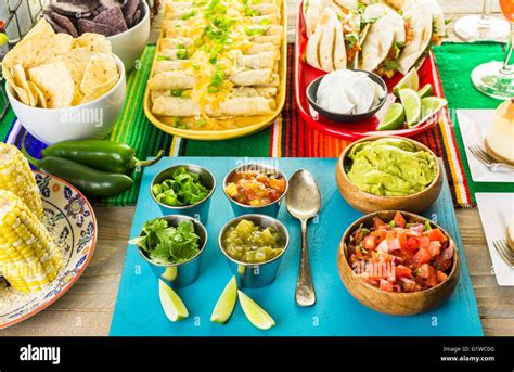 Fiesta party buffet table with traditional Mexican food Stock Photo - Alamy