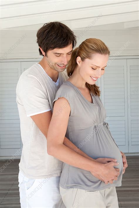 Man Holding Pregnant Girlfriends Belly Stock Image F