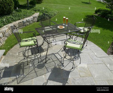 Outdoor furniture on stone patio, Pennsylvania, USA Stock Photo - Alamy