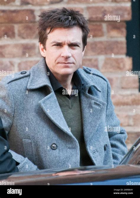 Actor Jason Bateman has a stern look on his face as he chats outside ...