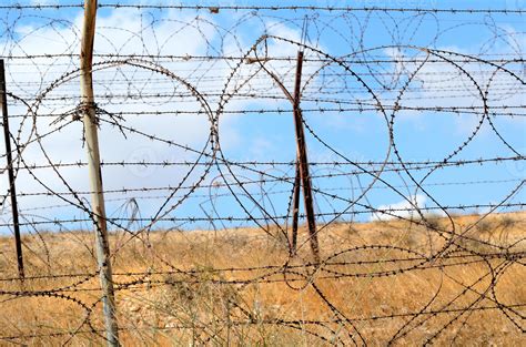 Barbed wire fence 794761 Stock Photo at Vecteezy