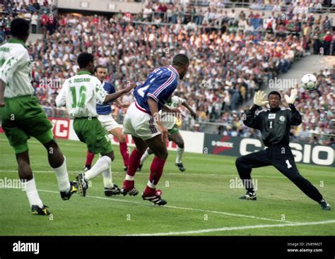 France S Forward Thierry Henry Center Jumpes For A Header Past Saudi