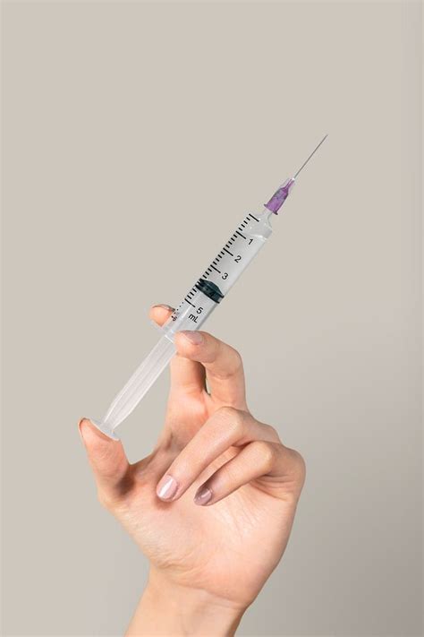 Hand Holding A Syringe Free Photo Rawpixel