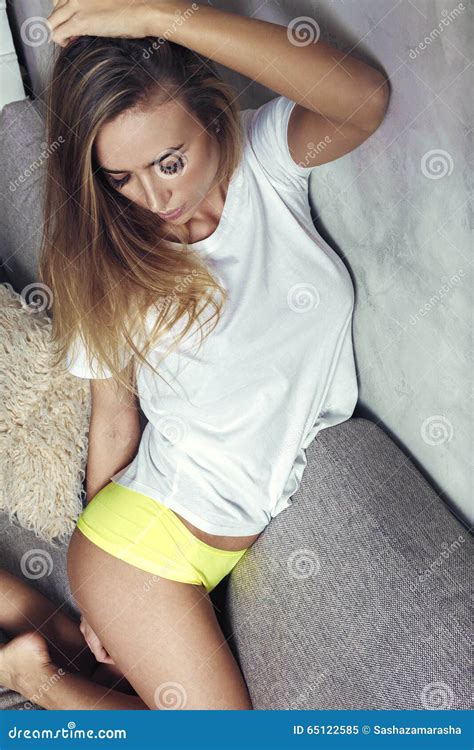 Beautiful Blonde Girl In White T Shirt Sexualy Posing Stock Image