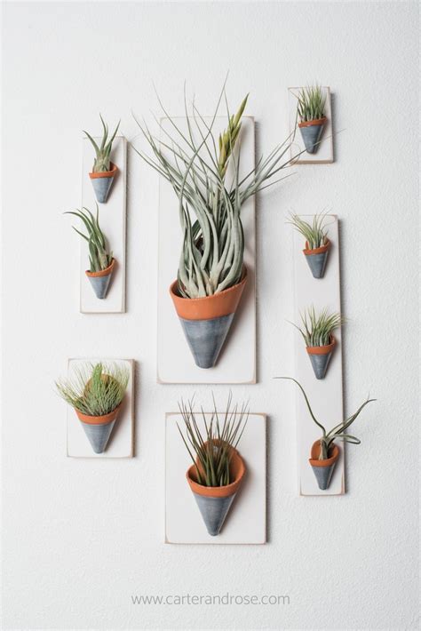 These Ceramic Wall Planters In Terracotta And Gray Glaze Create A