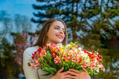 Premium Photo Girl Flowers Spring Outdoors Spring Concept Beautiful