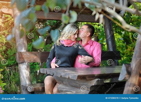 Lovers Kissing On A Bench In The Park Stock Photo Image Of Lights