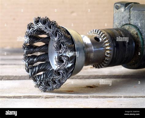 cup wire brush attached to electric drill machine, closeup Stock Photo ...