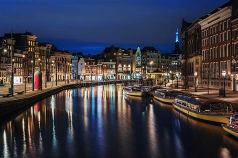 Amsterdam Canal, Amstel River with City Illumination Reflection ...