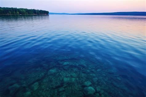 Premium Photo Shimmering Lake Surface At Dusk