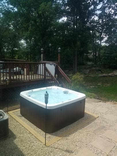 Hot Tub With Gravel Base For Serene Outdoor Relaxation