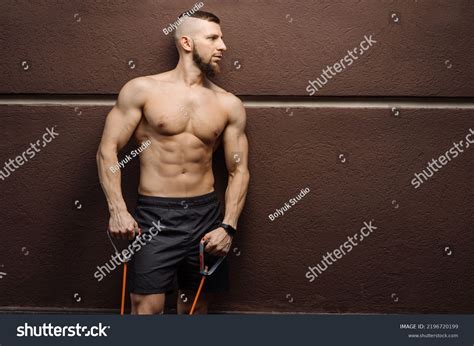 Muscular Man Naked Torso Stratching Rubber Stock Photo