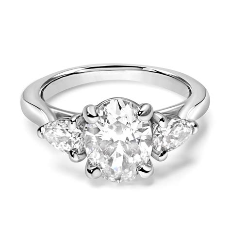 Oval Diamond Engagement Ring With Pear Shape Sides In White Gold