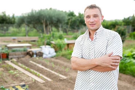 Smiling Adult Man Amateur Gardener Posing In Backyard Vegetable Garden Stock Image Image Of