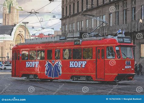 Red Tram Transporting People In The Central Part Of The Helsinki