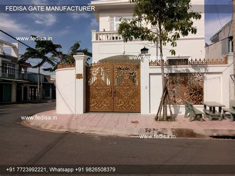 a white building with an iron gate in front of it