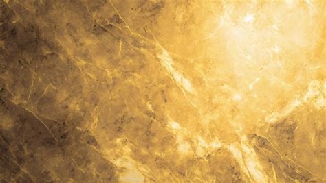 Premium Photo | A gold marble wall with a dark background and a light ...