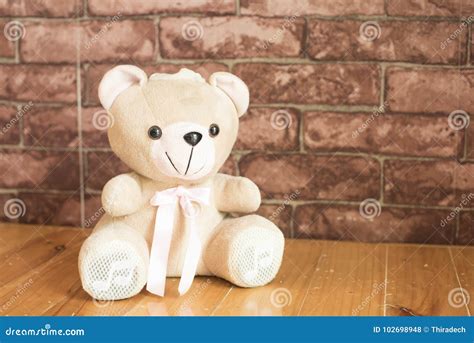 Teddy Bear on the Background the Brown Wallpaper. Stock Photo - Image ...