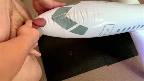 Fat Guy With A Small Penis Masturbating With A Vibrator And Cumming On An Inflatable Airplane