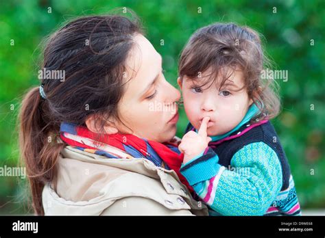 2 And A Half Year Old Girl With Downs Syndrome With Her Mother Stock