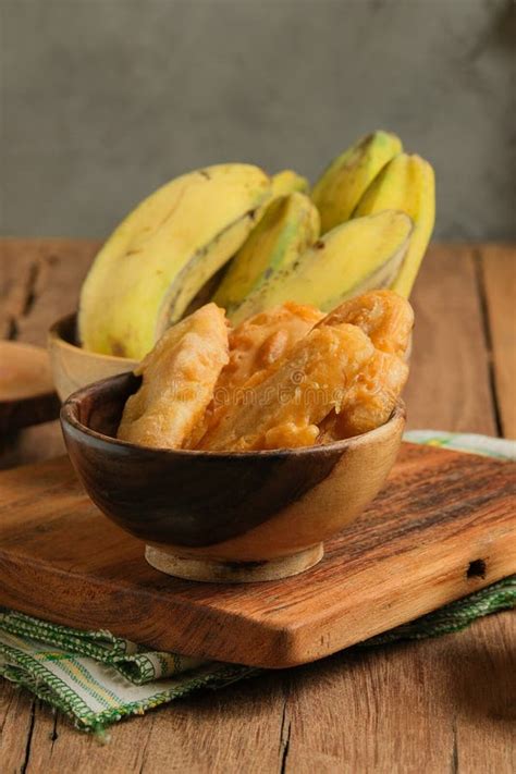 Pisang Goreng Or Fried Banana Served On Wooden Table Stock Photo