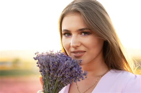 Premium Photo Close Up Portrait Of A Young Woman Holding Bouquet Of