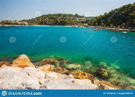 Azure Sea Stones At The Shore Vacation Near The Sea Stock Photo