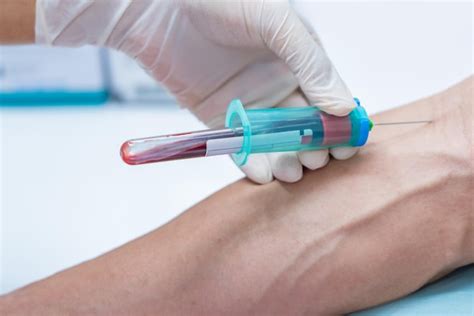 Premium Photo Cropped Hand Of Doctor Examining Patient