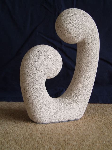 A White Sculpture Sitting On Top Of A Carpet Covered Floor